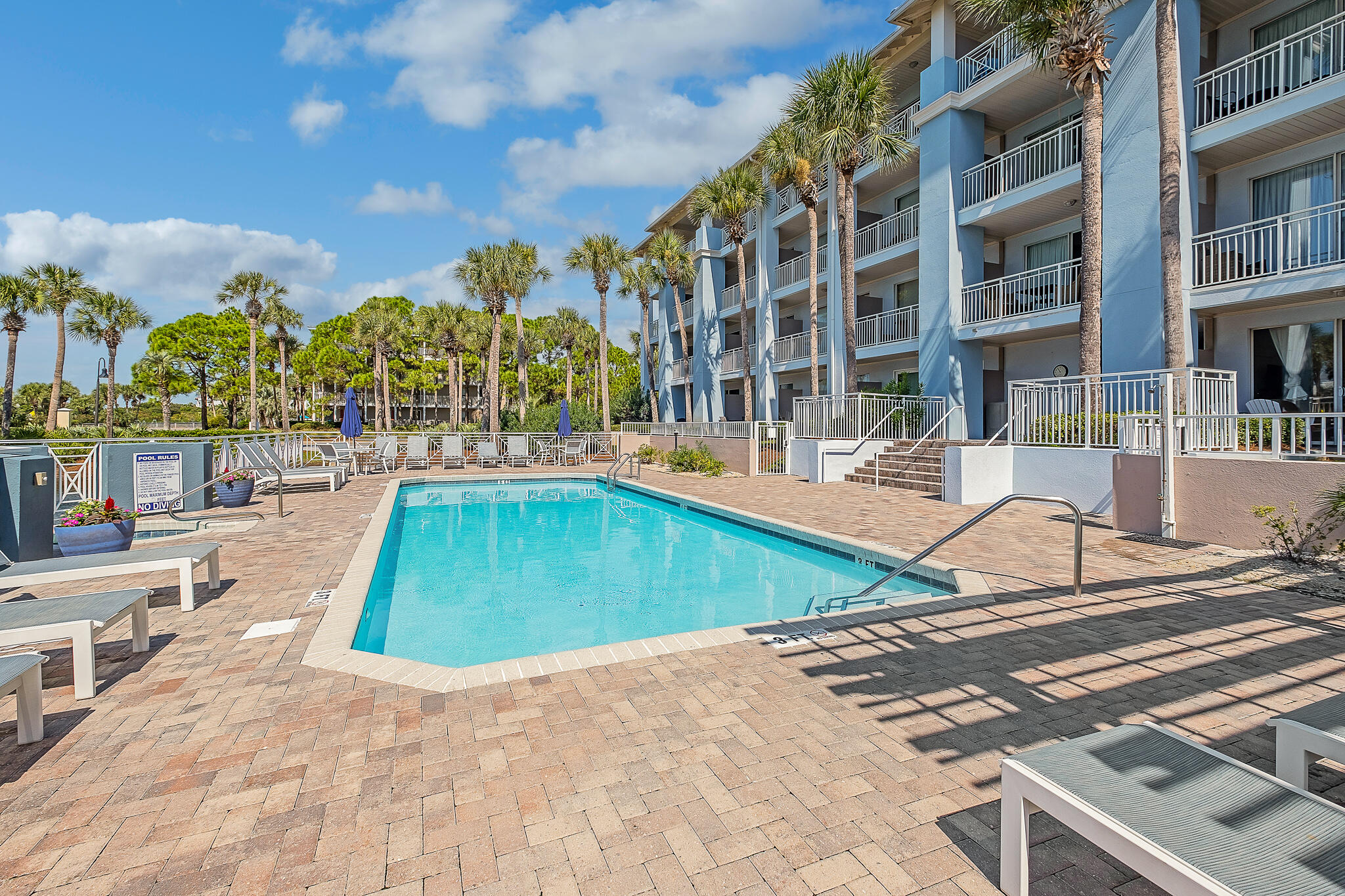 145 Spires Lane, Unit 411 Santa Rosa Beach, FL 32459 - Photo 39 of 44 a view of a swimming pool with a lounge chairs