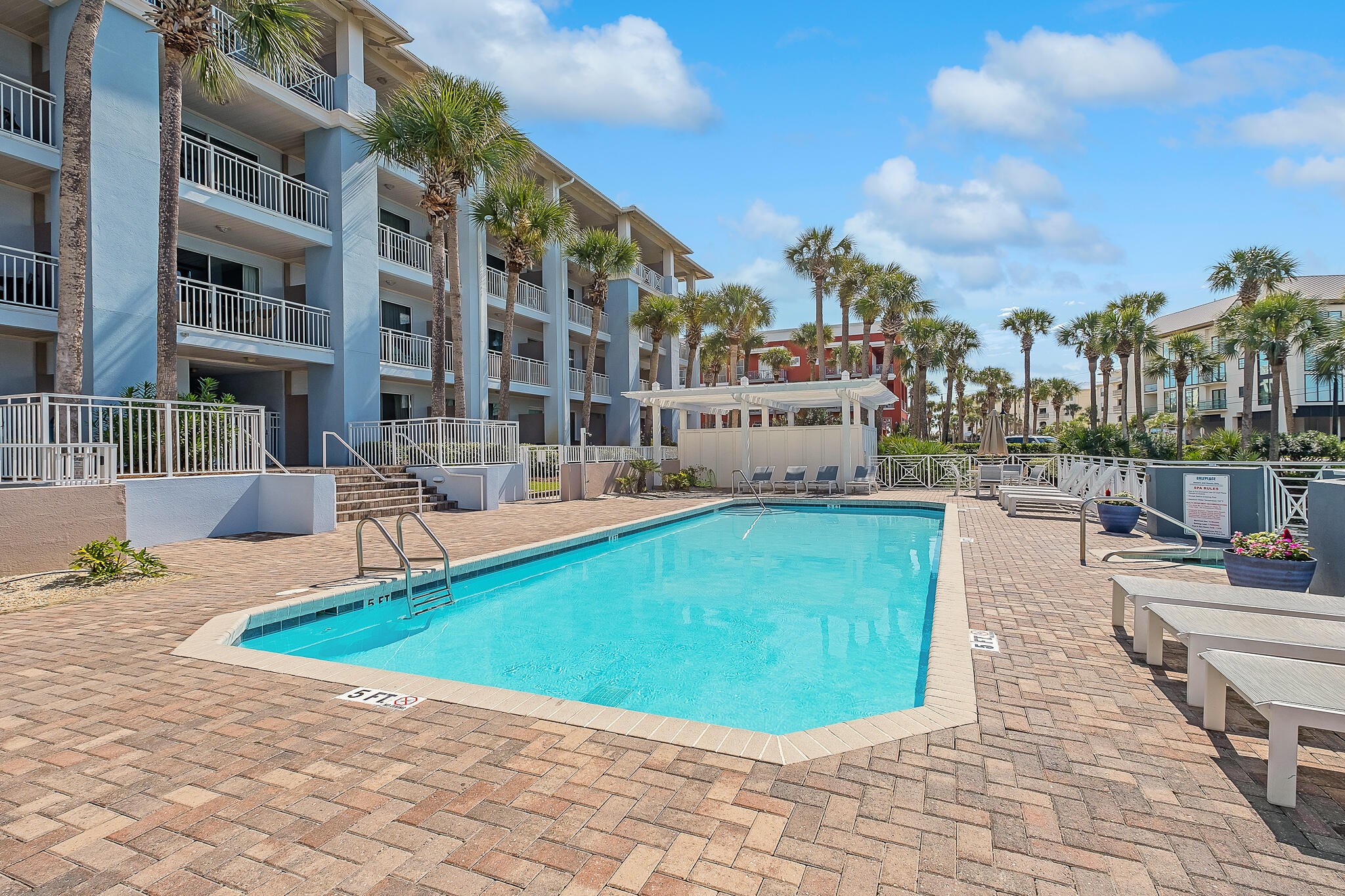 145 Spires Lane, Unit 411 Santa Rosa Beach, FL 32459 - Photo 40 of 44 a view of a swimming pool with a lounge chairs
