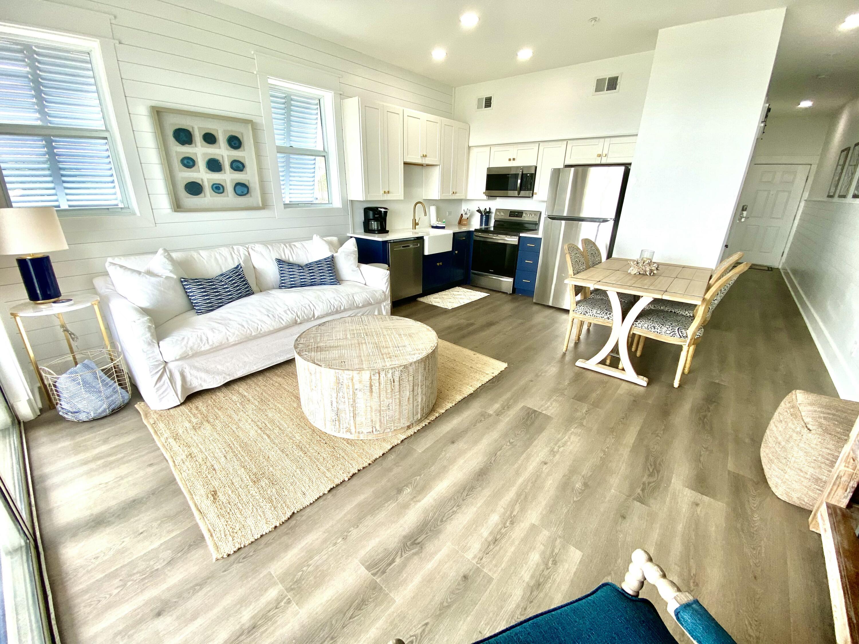 145 Spires Lane, Unit 411 Santa Rosa Beach, FL 32459 - Photo 9 of 44 a living room with furniture and a table