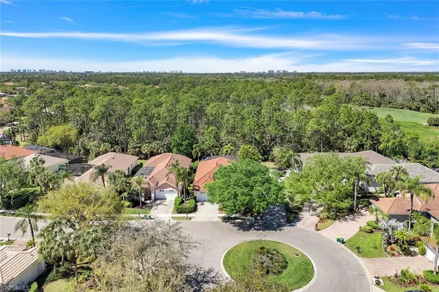 a view of a garden with a table and chairs