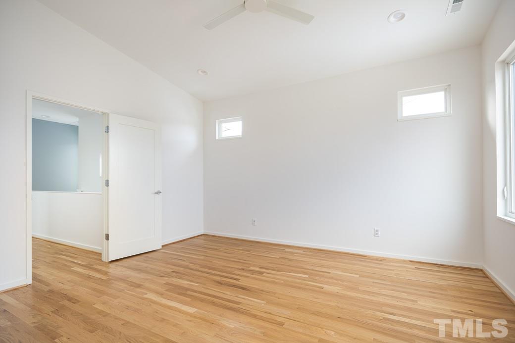 617 New Bern Avenue Raleigh, NC 27601 - Photo 12 of 16 a view of empty room with wooden floor