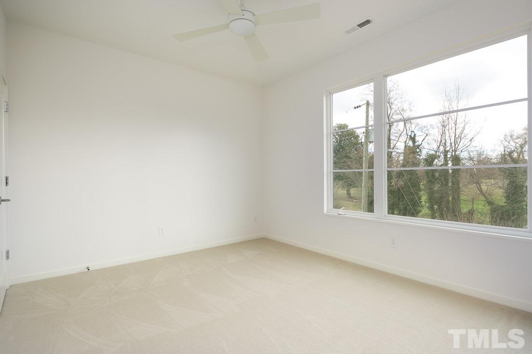 617 New Bern Avenue Raleigh, NC 27601 - Photo 13 of 16 an empty room with a window