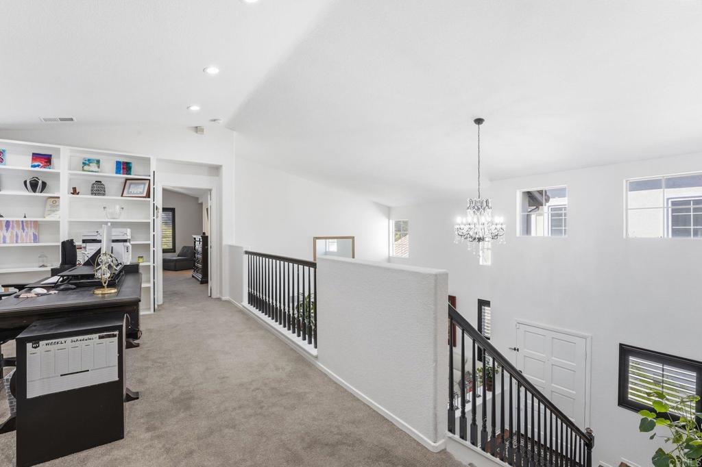 2505 Whispering Palms Loop Chula Vista, CA 91915 - Photo 20 of 45 a view of a hallway with workspace