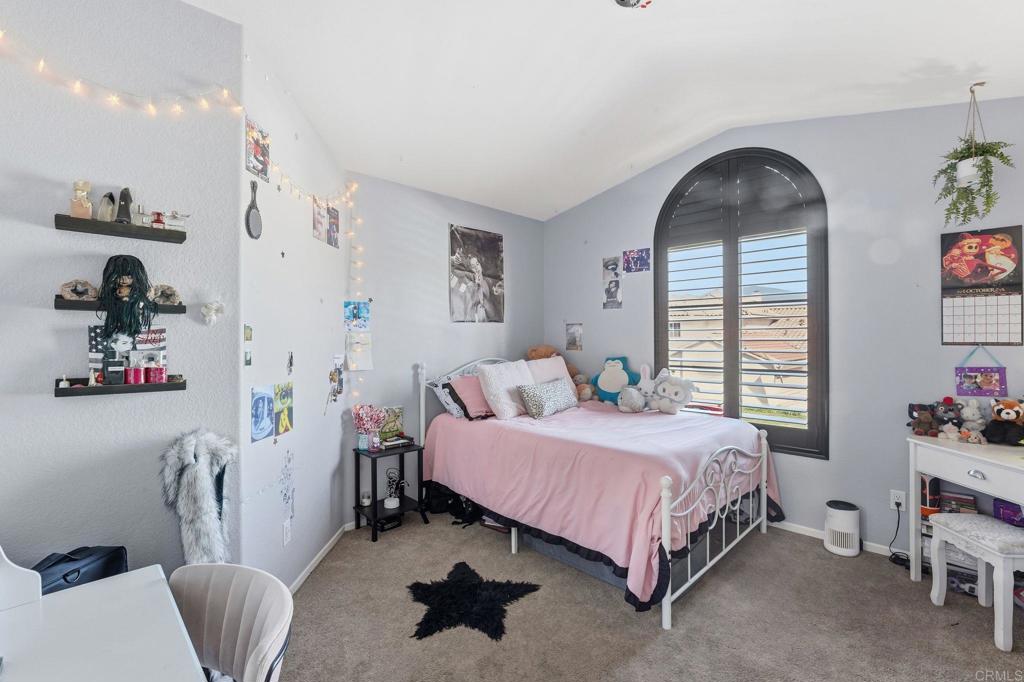 2505 Whispering Palms Loop Chula Vista, CA 91915 - Photo 27 of 45 a bedroom with a bed and a window