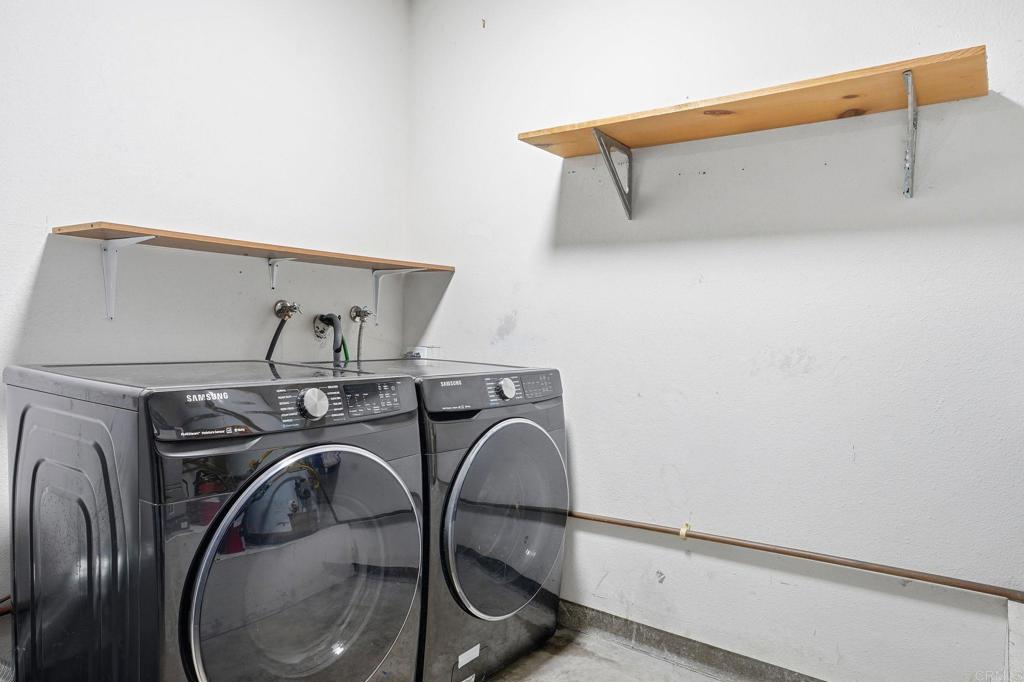 2505 Whispering Palms Loop Chula Vista, CA 91915 - Photo 30 of 45 a utility room with dryer and washer