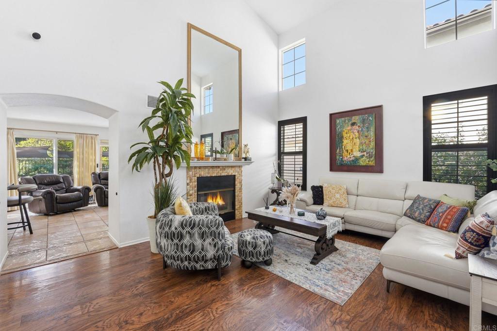 2505 Whispering Palms Loop Chula Vista, CA 91915 - Photo 3 of 45 a living room with furniture and a fireplace
