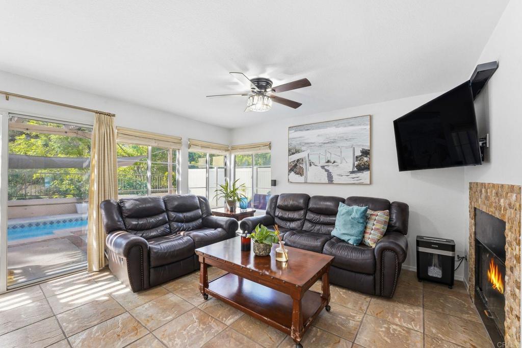 2505 Whispering Palms Loop Chula Vista, CA 91915 - Photo 5 of 45 a living room with furniture and a flat screen tv