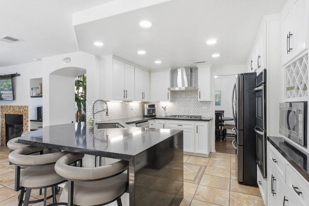 2505 Whispering Palms Loop Chula Vista, CA 91915 - Photo 7 of 45 a kitchen with refrigerator and cabinets