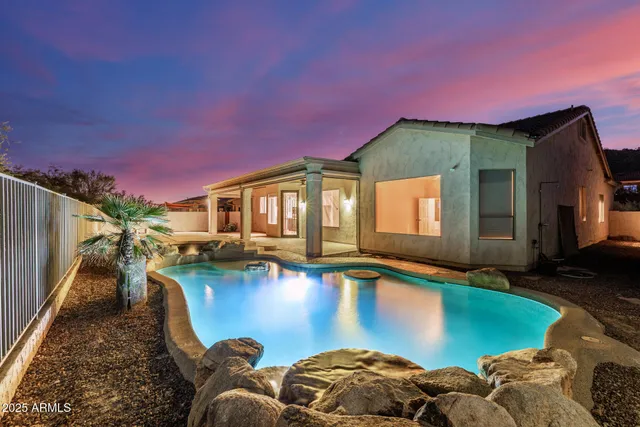 a swimming pool with outdoor seating yard and barbeque oven
