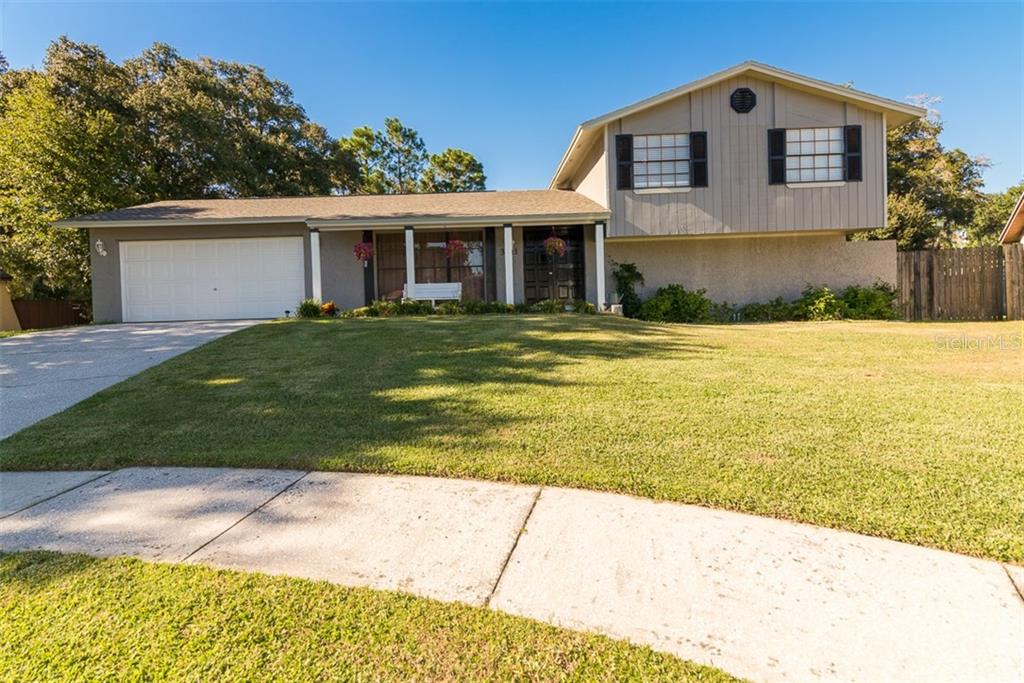 3611 Casaba Loop Valrico, FL 33596 - Photo 1 of 1 a front view of a house with a yard and garage