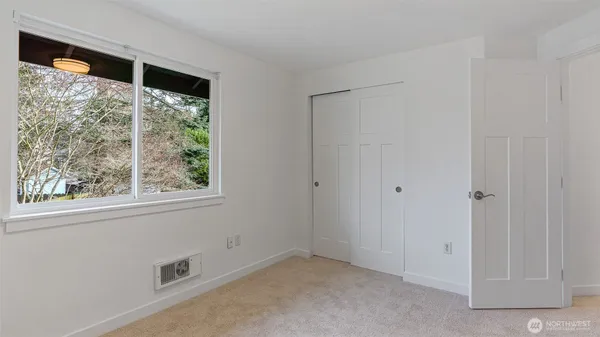 a big room with windows and closet