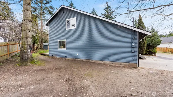 a view of a house with a yard and garage