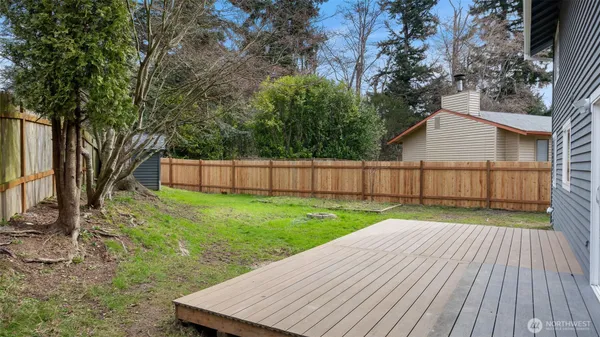 a view of a backyard with wooden floor