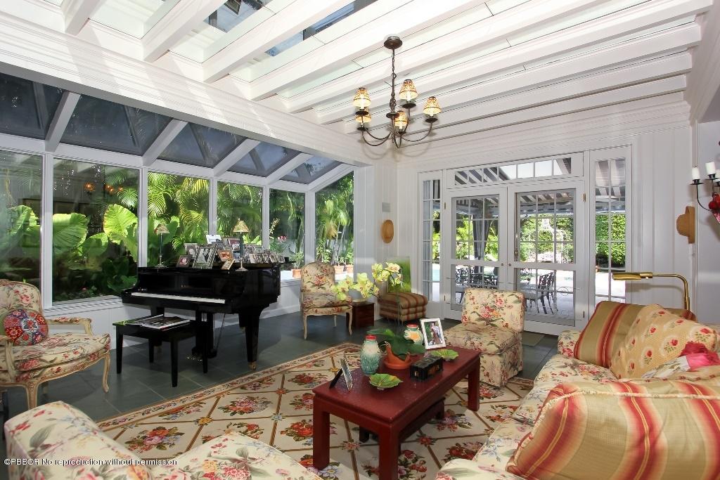 275 Monterey Road Palm Beach, FL 33480 - Photo 6 of 9 a living room with patio furniture and a large window