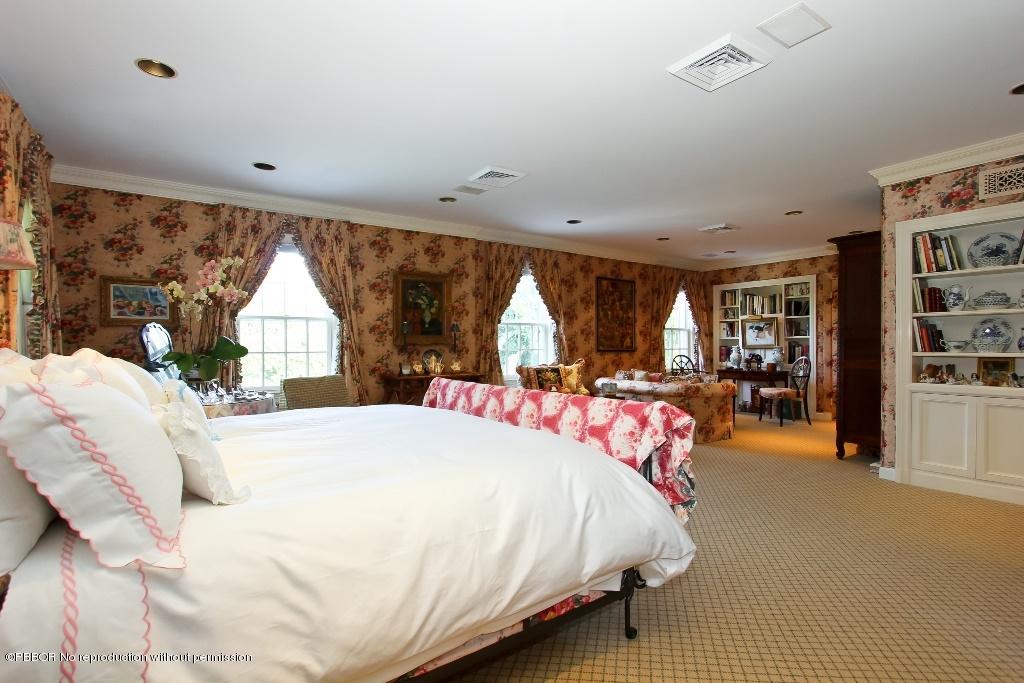275 Monterey Road Palm Beach, FL 33480 - Photo 7 of 9 a bedroom with a large bed and a large window