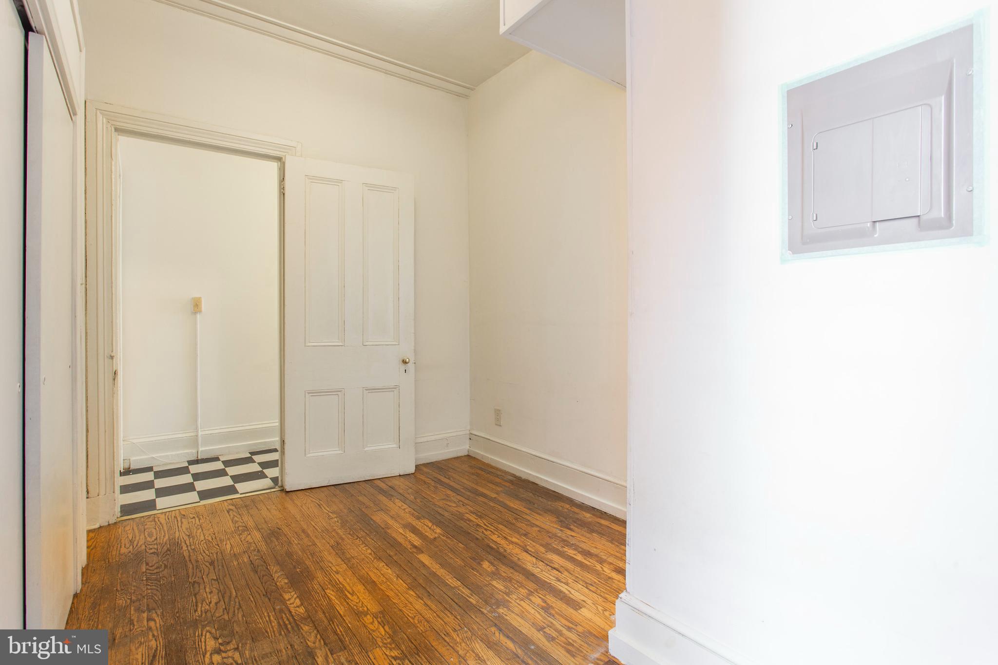 1807 Spruce Street, Unit 2F Philadelphia, PA 19103 - Photo 10 of 17 a view of a room with wooden floor and a bathroom