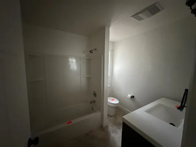 a bathroom with a sink and a toilet