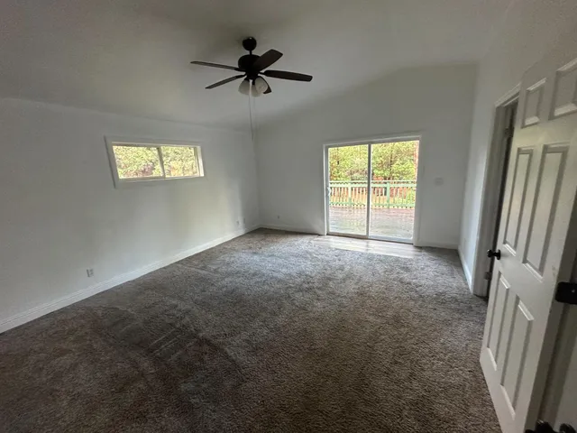 a view of empty room with windows