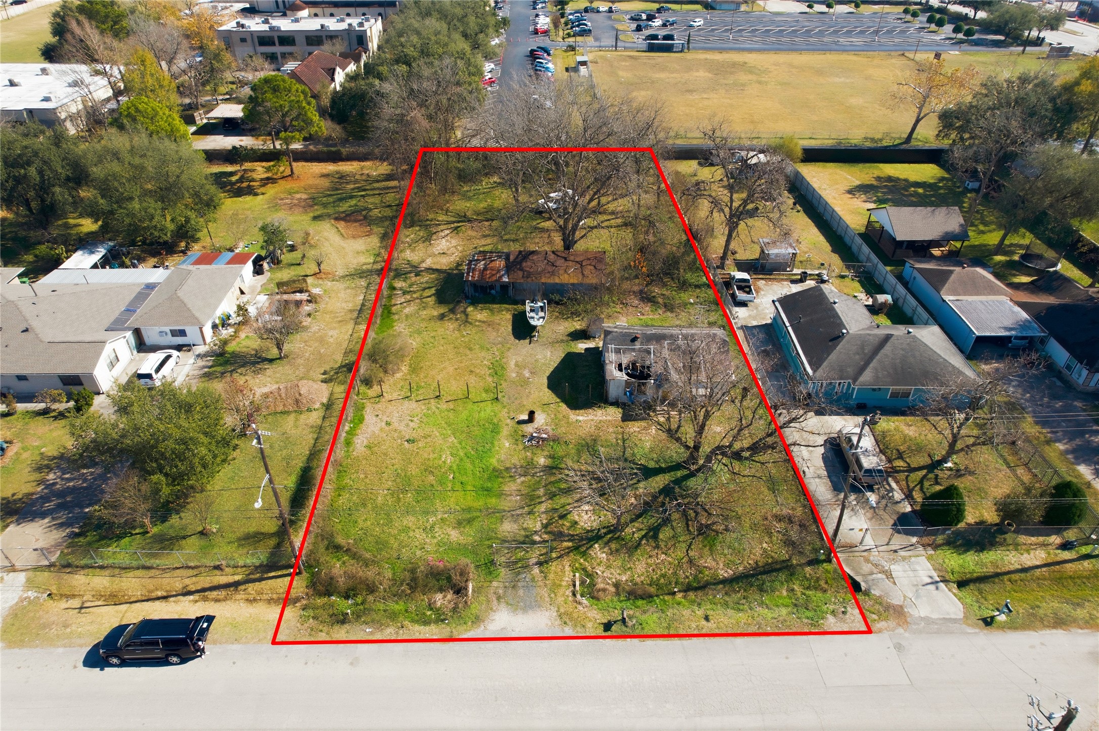 an aerial view of residential houses with outdoor space