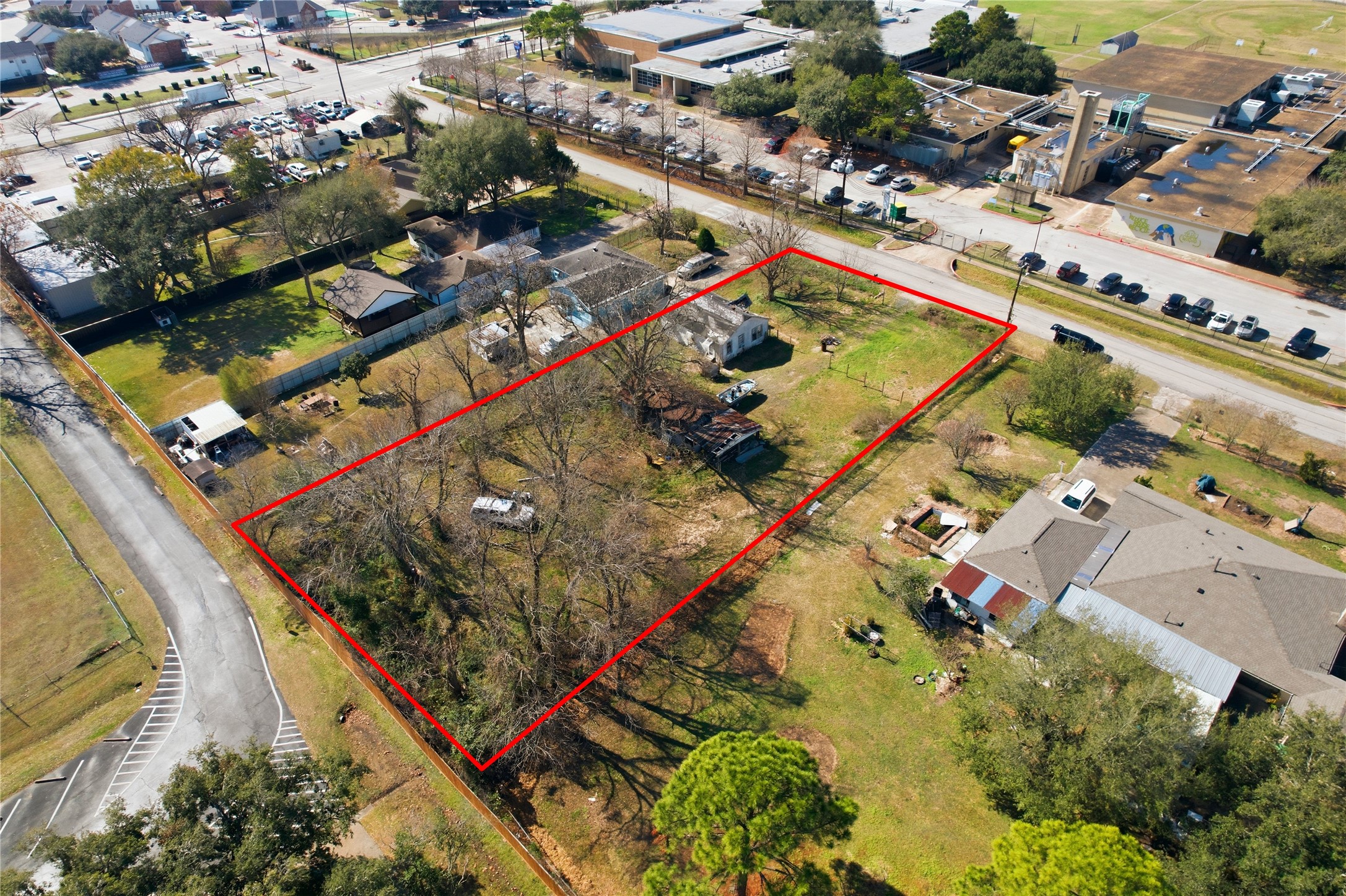 7512 Van Ness Street Houston, TX 77037 - Photo 2 of 11 an aerial view of a tennis ground and a cars park side of the road