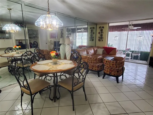 a outdoor dining space with furniture and window