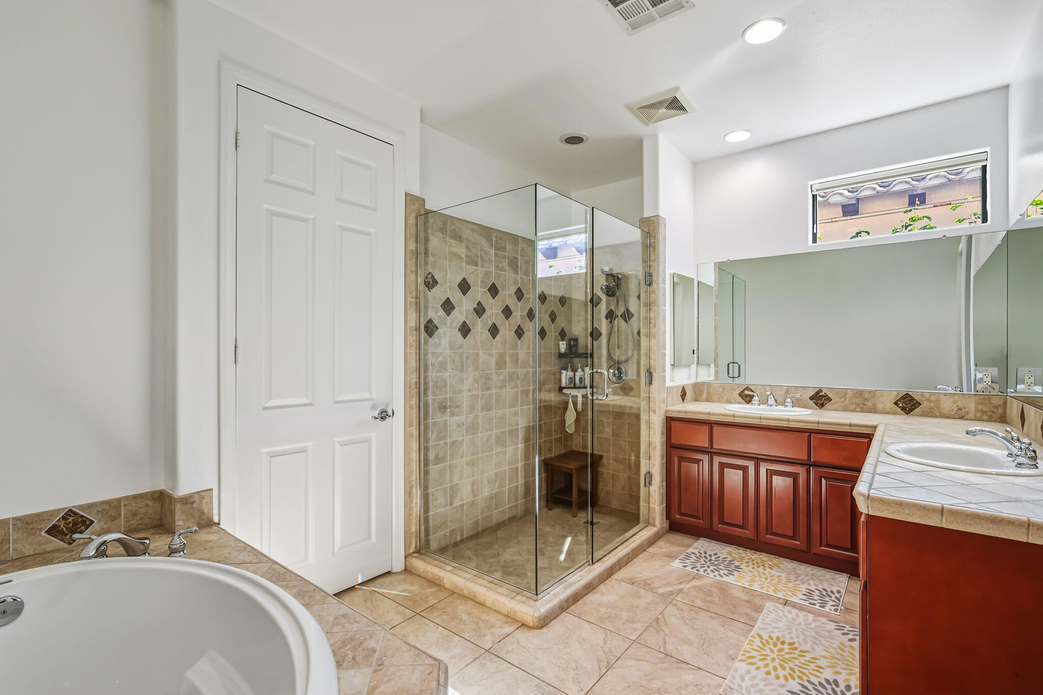 57914 Santa Rosa Trail La Quinta, CA 92253 - Photo 11 of 14 a bathroom with a granite countertop sink a mirror and shower