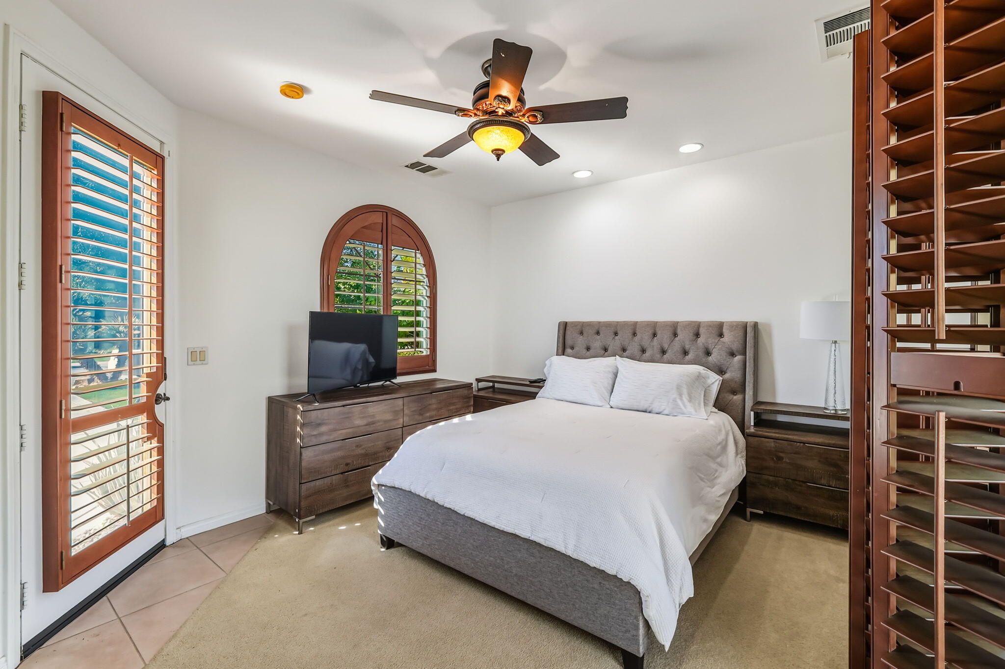 57914 Santa Rosa Trail La Quinta, CA 92253 - Photo 13 of 14 a bedroom with a bed and a chandelier