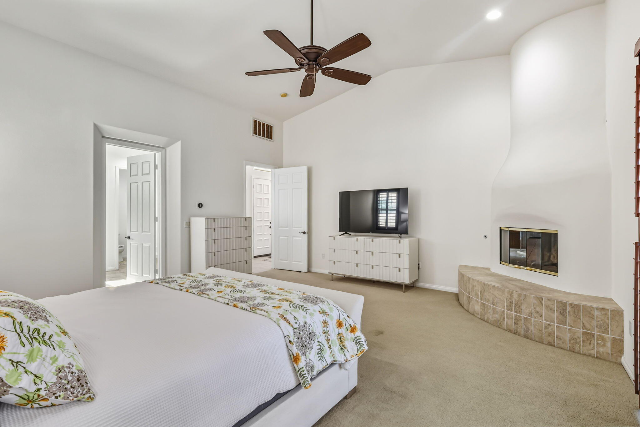 57914 Santa Rosa Trail La Quinta, CA 92253 - Photo 10 of 14 a spacious bedroom with a bed and a television