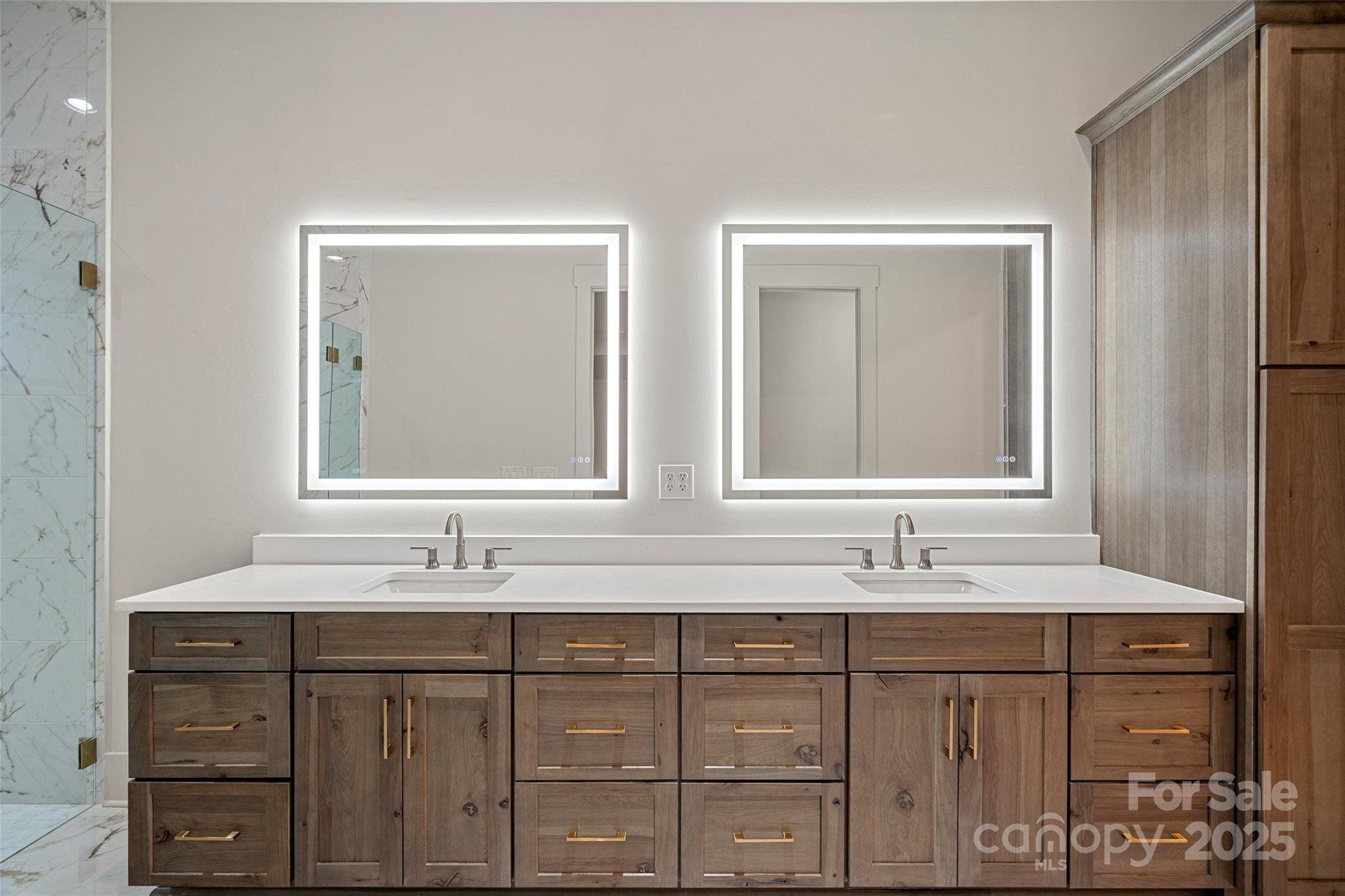 515 Kemp Road Mooresville, NC 28117 - Photo 13 of 24 a bathroom with double vanity sinks and a mirror