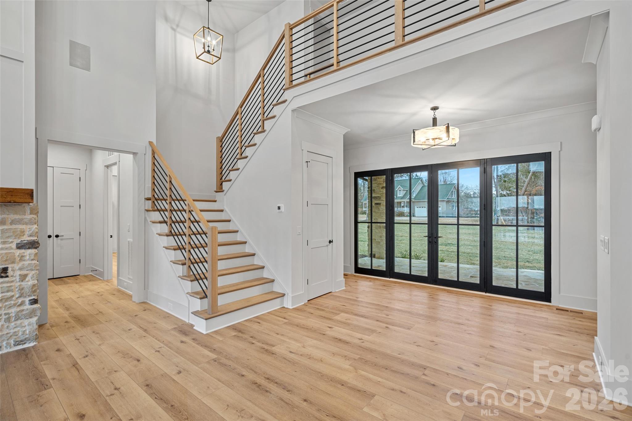 515 Kemp Road Mooresville, NC 28117 - Photo 20 of 34 a view of a livingroom with wooden floor and stairs