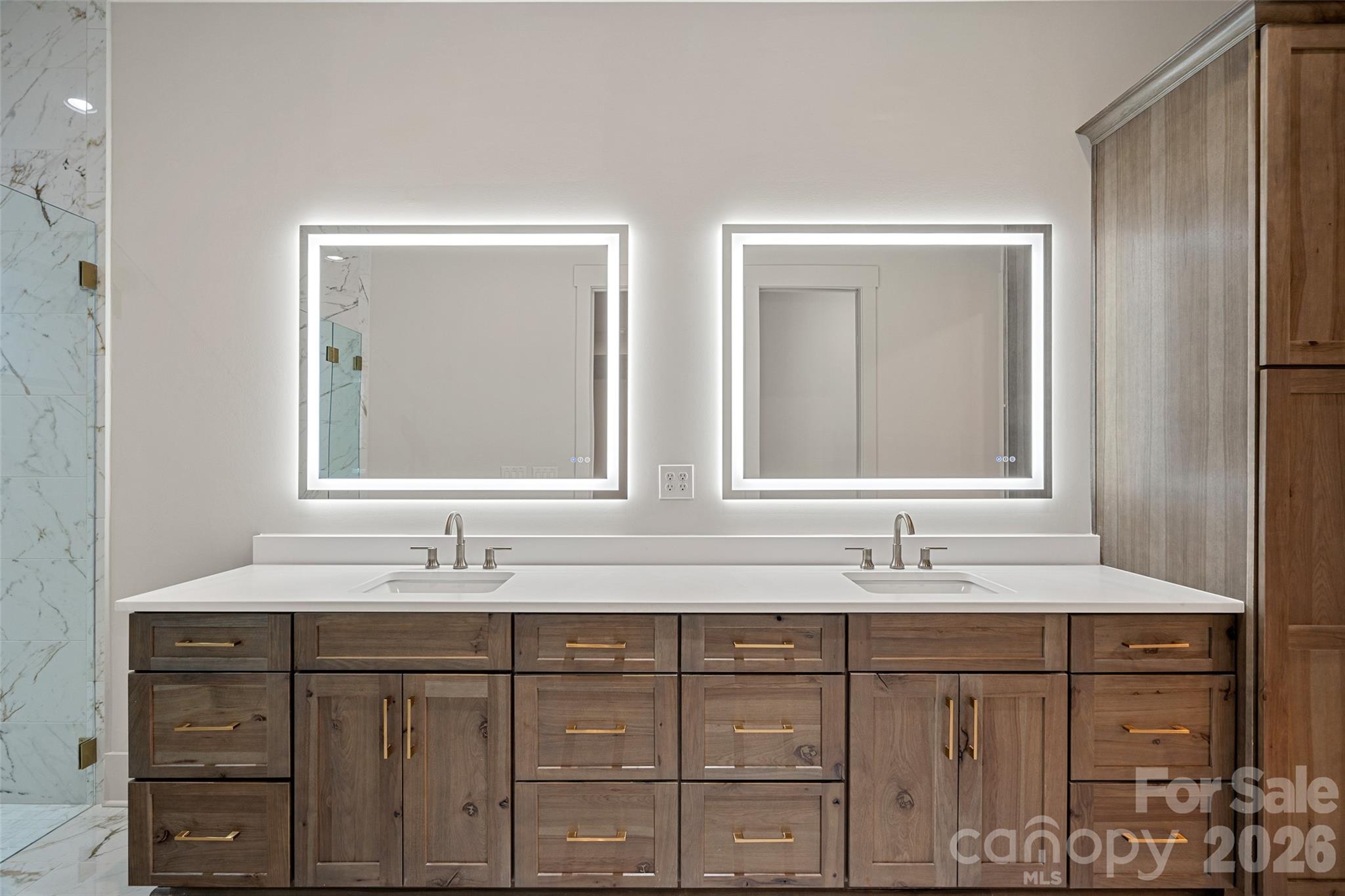 515 Kemp Road Mooresville, NC 28117 - Photo 21 of 34 a bathroom with double vanity sinks and a mirror