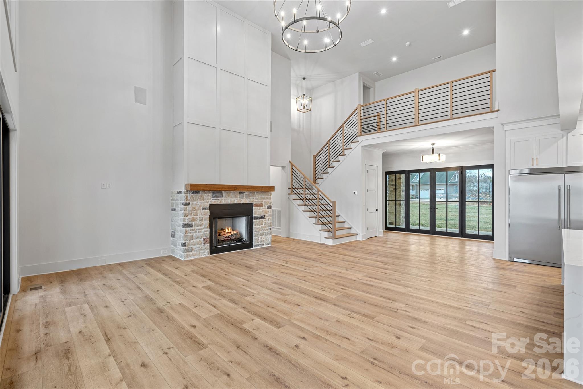 515 Kemp Road Mooresville, NC 28117 - Photo 24 of 34 a view of empty room with wooden floor and fireplace