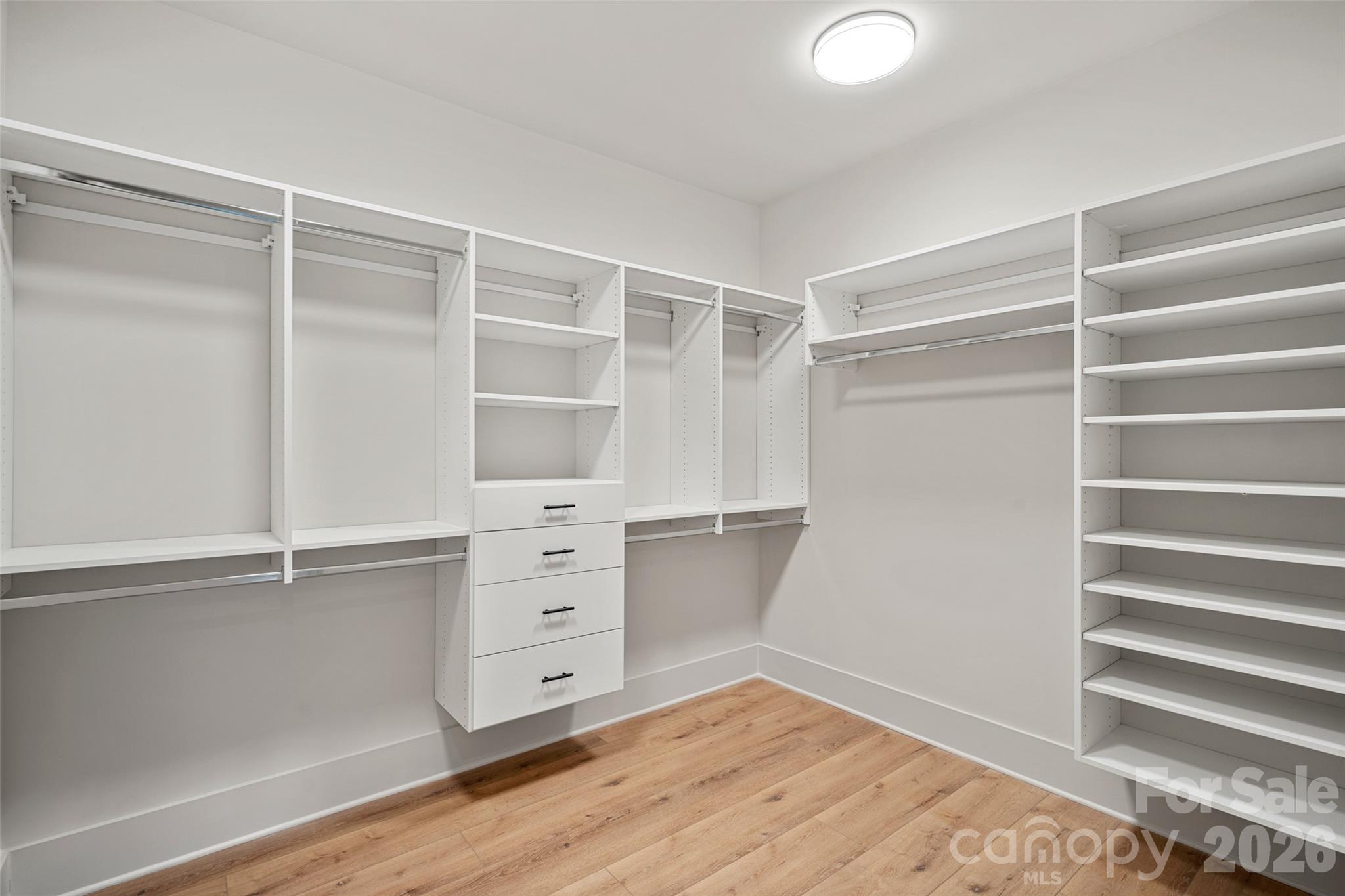 515 Kemp Road Mooresville, NC 28117 - Photo 25 of 34 a view of walk in closet with empty racks