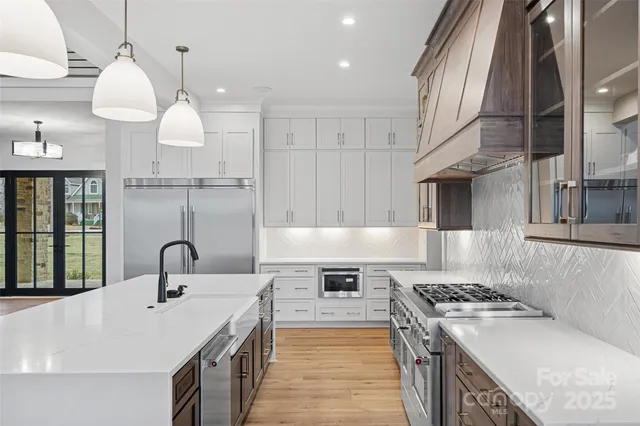 a kitchen with a stove and a sink