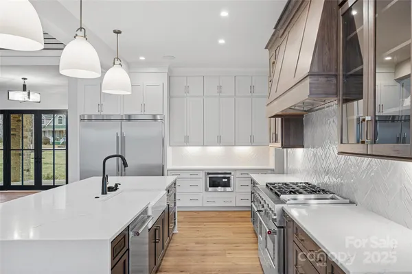 a kitchen with a stove and a sink
