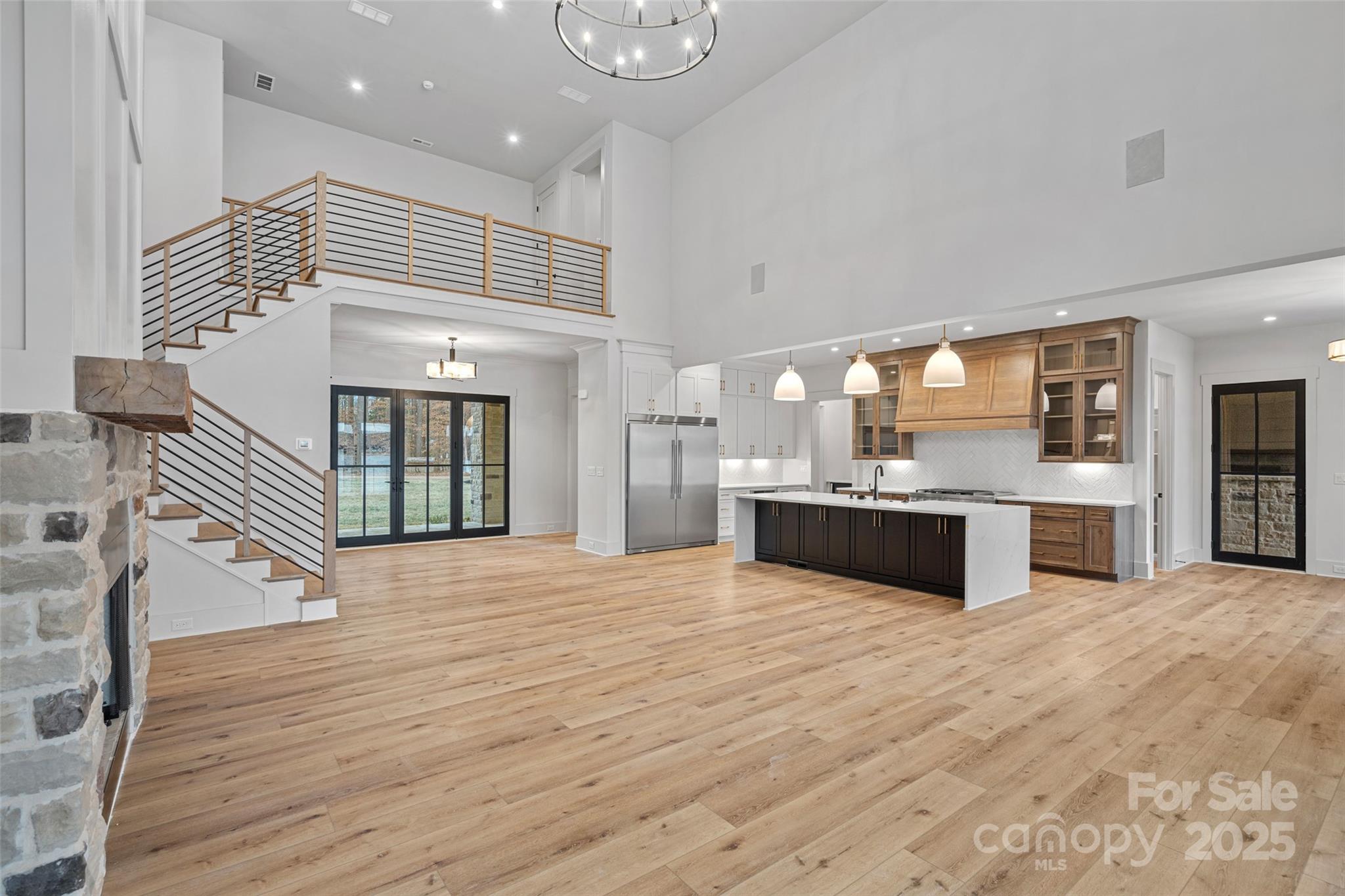 515 Kemp Road Mooresville, NC 28117 - Photo 7 of 24 a large white kitchen with a large counter top and stainless steel appliances