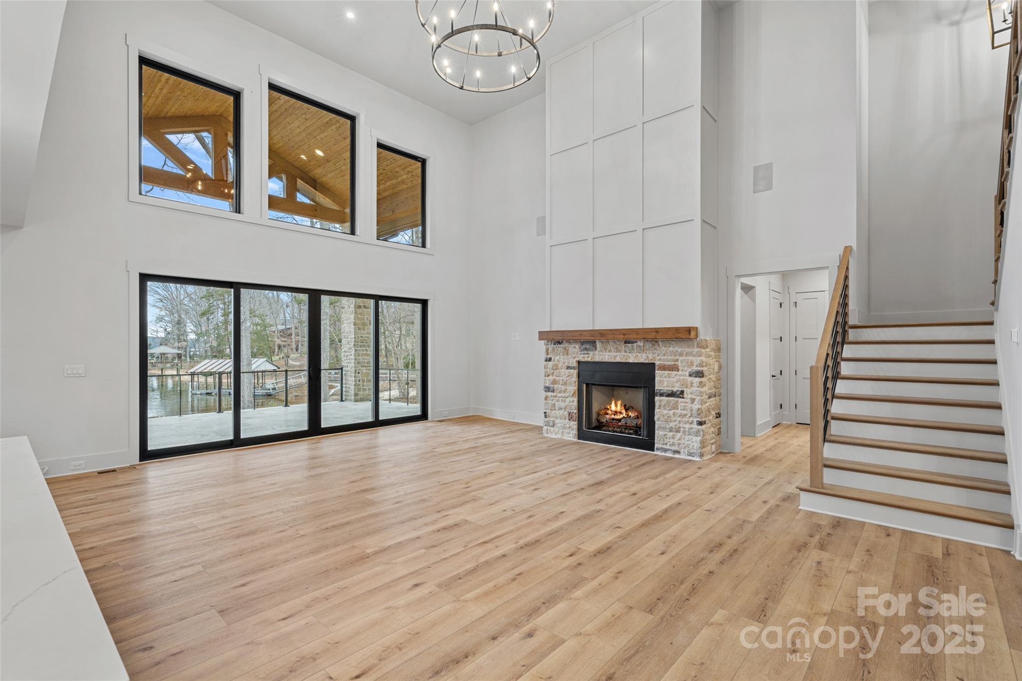 515 Kemp Road Mooresville, NC 28117 - Photo 9 of 24 a view of empty room with fireplace and wooden floor
