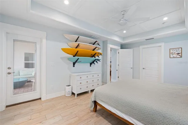 a bathroom with a granite countertop sink a potted plant and a shower