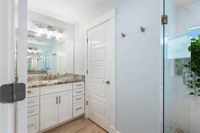 a bedroom with toys and a wooden floor