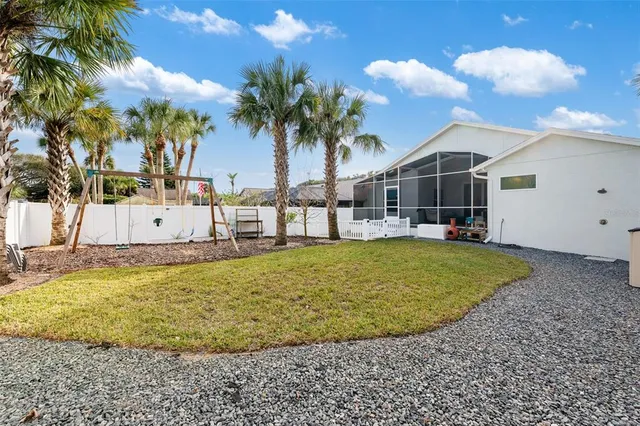 a view of a backyard of the house