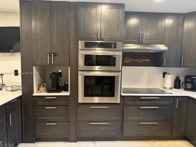 a kitchen with a stove and a microwave