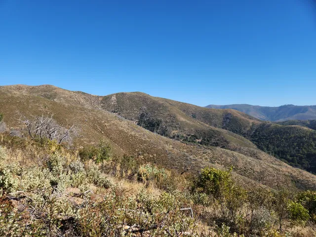 a view of mountain view with mountains in the background