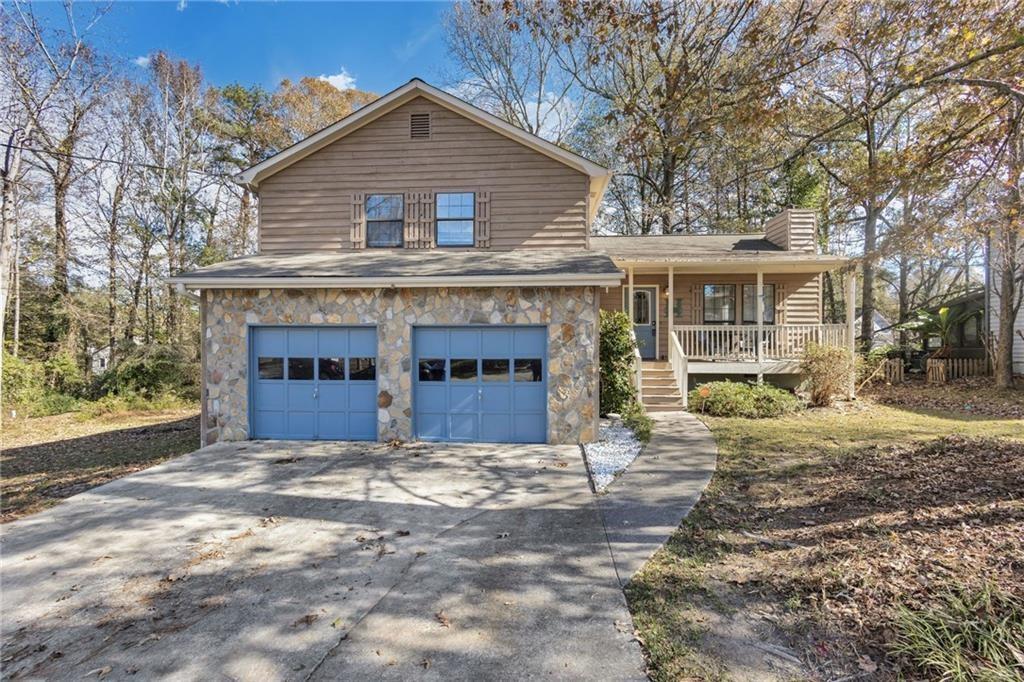 560 Sunset Drive Lithia Springs, GA 30122 - Photo 1 of 1 a view of house with outdoor space and sitting area