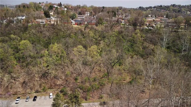 an aerial view of residential house and outdoor space