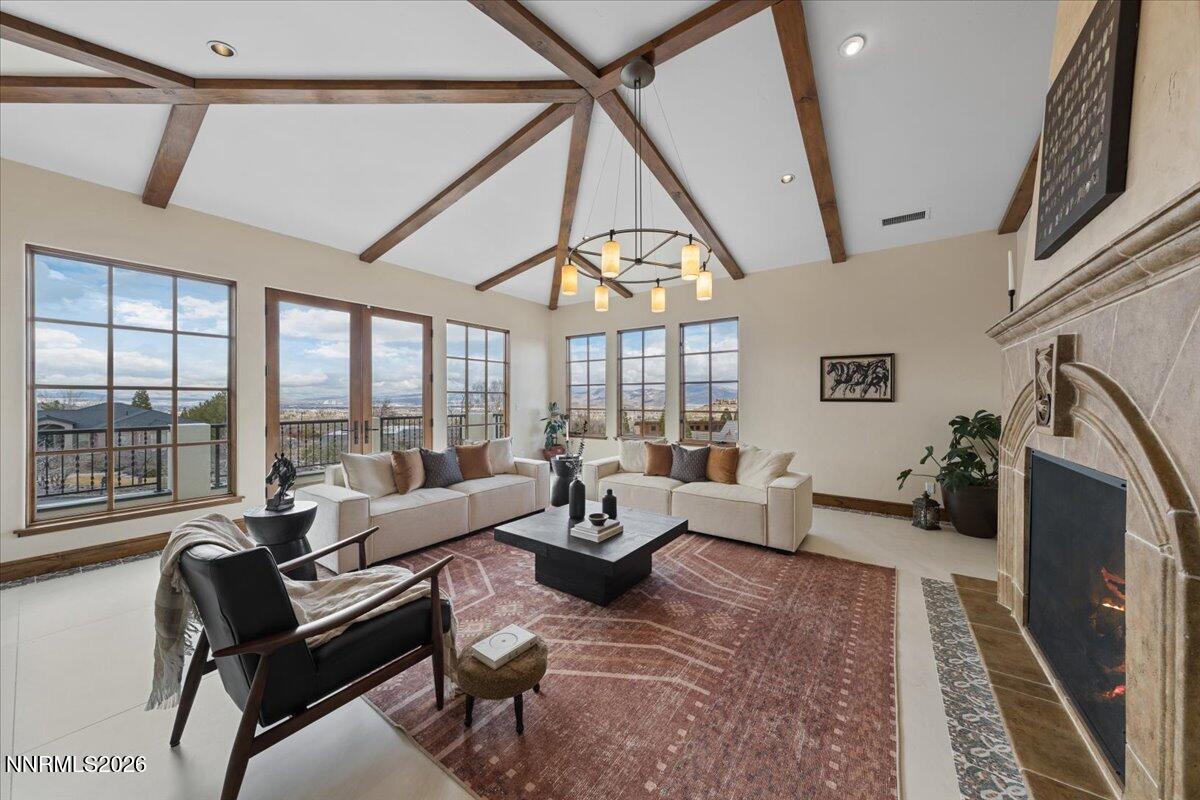 4400 Slide Mountain Circle Reno, NV 89511 - Photo 11 of 93 a living room with furniture large window and a flat screen tv