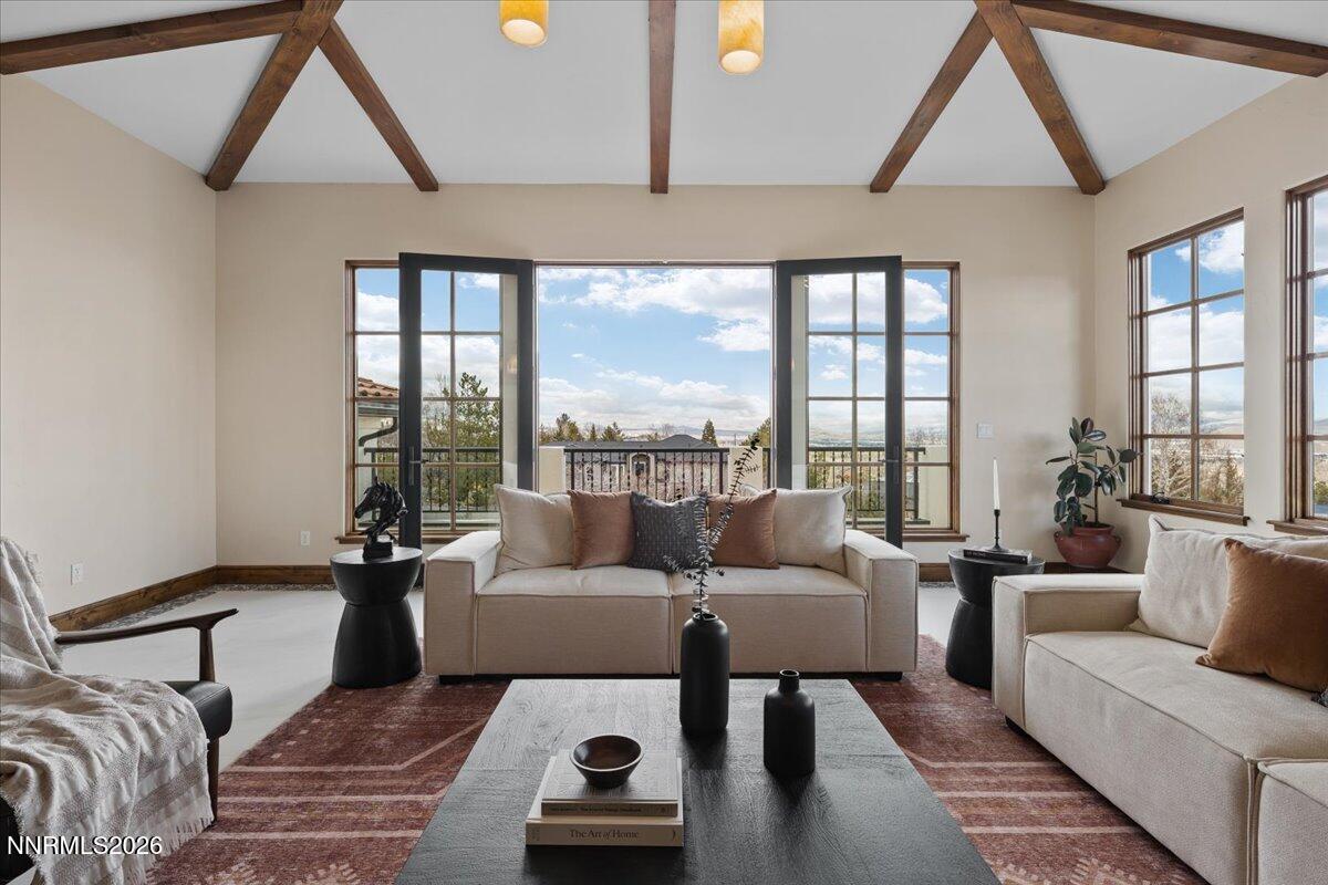 4400 Slide Mountain Circle Reno, NV 89511 - Photo 16 of 93 a living room with furniture and a floor to ceiling window