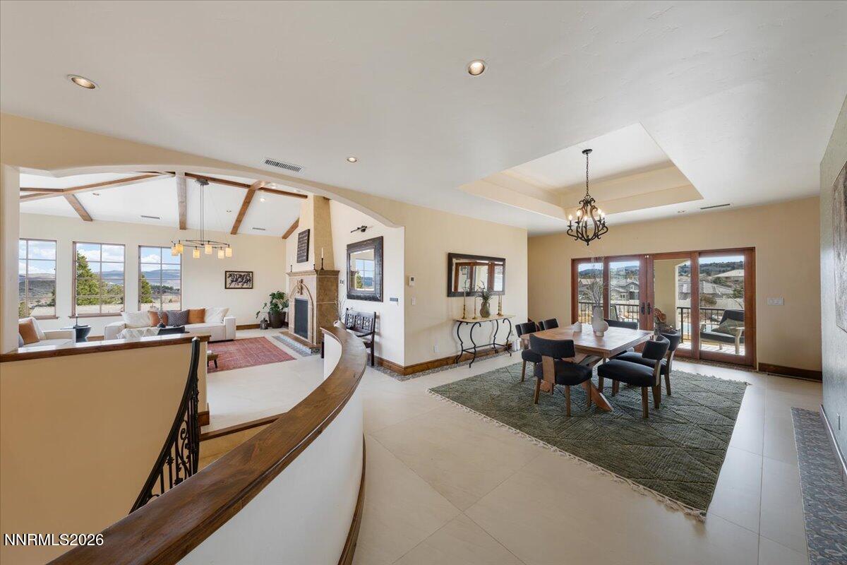 4400 Slide Mountain Circle Reno, NV 89511 - Photo 18 of 93 a living room with furniture large window and flat screen tv