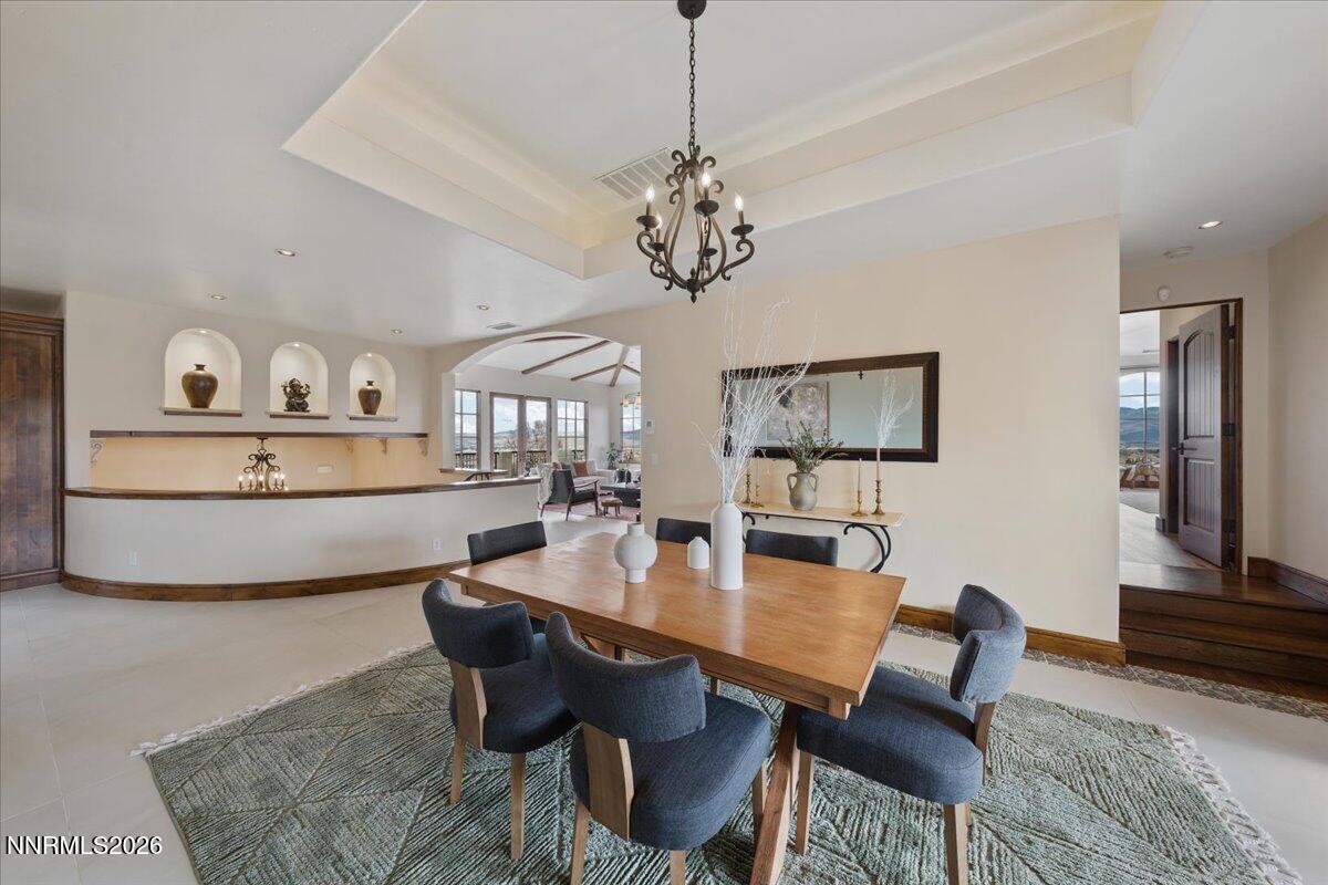 4400 Slide Mountain Circle Reno, NV 89511 - Photo 21 of 93 a view of a dining room with furniture and wooden floor