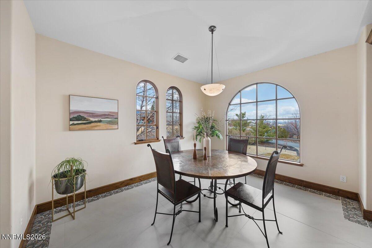 4400 Slide Mountain Circle Reno, NV 89511 - Photo 24 of 93 a view of a dining room with furniture window and wooden floor