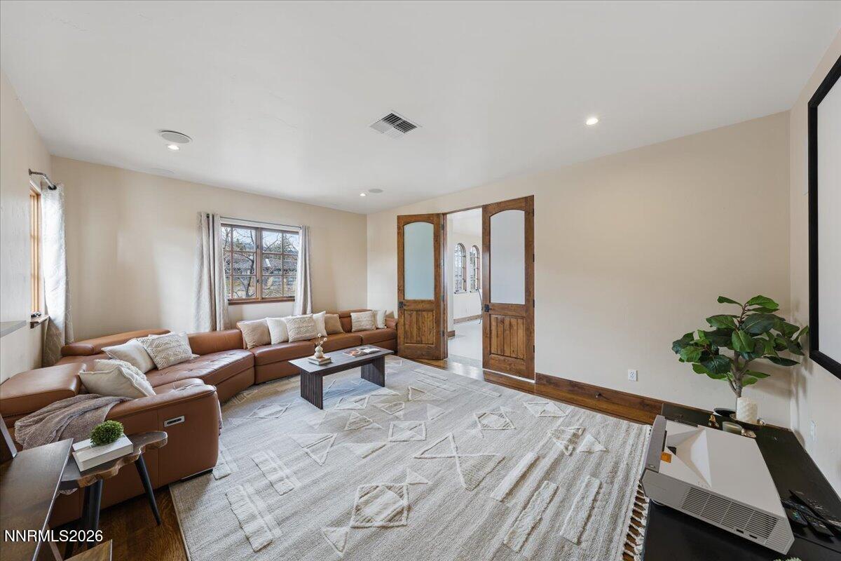 4400 Slide Mountain Circle Reno, NV 89511 - Photo 35 of 93 a living room with furniture and a potted plant